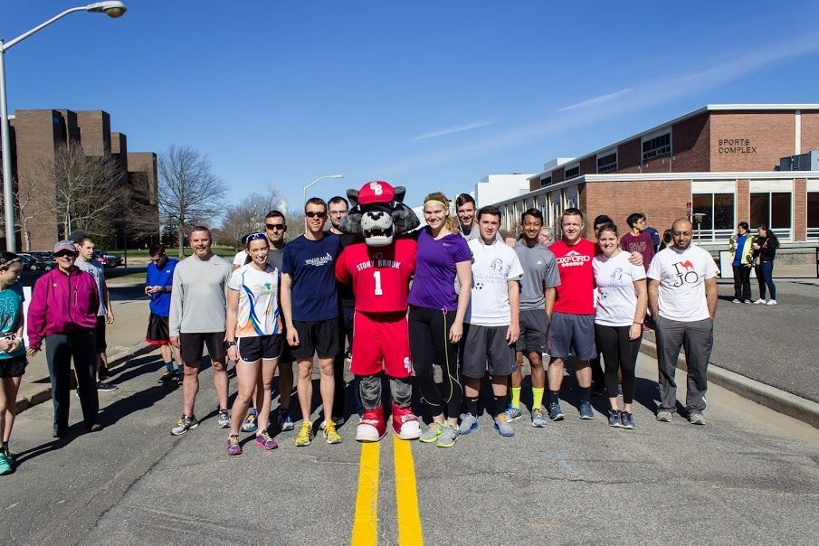 Competitors standing with Wolfie before getting into position. Photo by Han John Tse