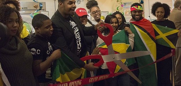 Moments before Island Soul is revealed, students pivotal to the restaurant's creation prepare to cut the ribbon. Photo by Janelle Clausen.