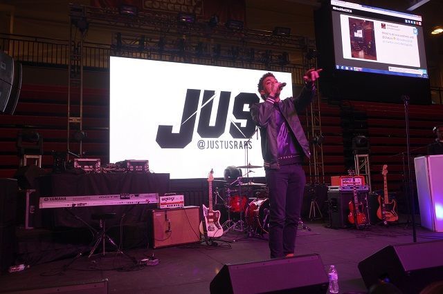 Student performer, JUS, rapping. 
Photo by Justin Cole