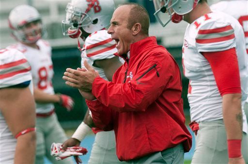 Stony Brook football coach Chuck Priore applauds his players as they warm up for an NCAA college football game against Maine in Orono, Maine, Saturday, Nov. 2, 2013. (AP Photo/Michael C. York)