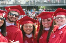 Students from the Stony Brook University School of Journalism celebrate at the school's commencement on May 20, 2016. Photo by Kayla Shults.