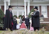 Volunteers perform an excerpt from A Christmas Carol in front of the Port Jefferson Free Library at the Dickens Festival on Dec. 7, 2013. Photo by Atiba Rogers